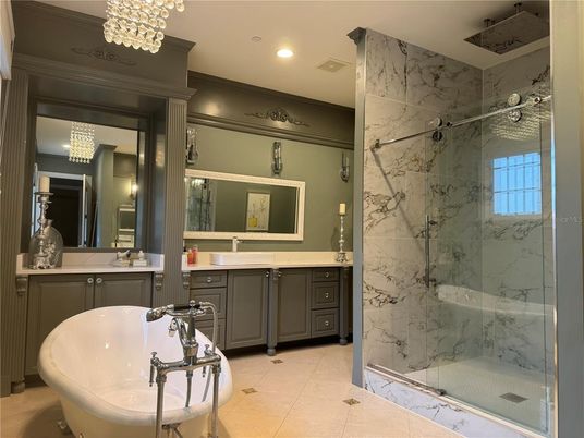 Bathroom, Dual Sink Vanities, Free Standing Baths, Glass Shower, Interior, Marble Walls, Pendant Lights, Recessed Lighting