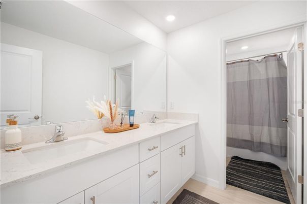 Bathroom, Dual Sink Vanities, Glass Shower, Interior, Recessed Lighting, Wood Texture Flooring