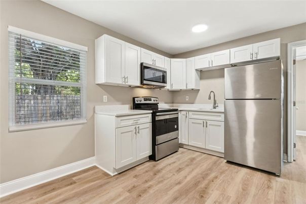 Interior, Kitchen, Recessed Lighting, Stainless Steel Appliances, Wood Texture Flooring
