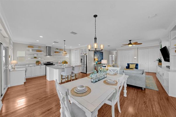 Chandelier, Dining room, Interior, Kitchen, Living room, Pendant Lights, Recessed Lighting, Stainless Steel Appliances, Wood Texture Flooring