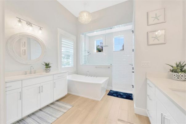Bathroom, Chandelier, Dual Sink Vanities, Free Standing Baths, Interior, Pendant Lights, Wood Texture Flooring