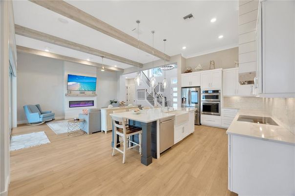 Dining room, Fireplace, Interior, Kitchen, Living room, Pendant Lights, Recessed Lighting, Stainless Steel Appliances, Wood Texture Flooring