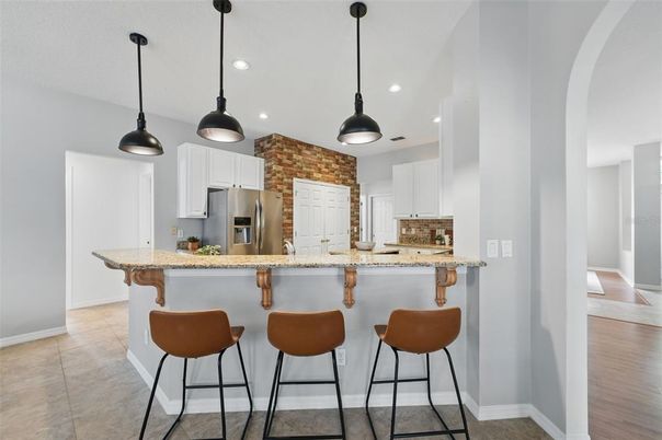 Interior, Kitchen, Pendant Lights, Recessed Lighting, Stainless Steel Appliances, Stone Walls, Wood Texture Flooring