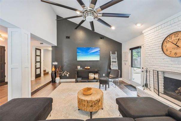 Fireplace, Interior, Living room, Recessed Lighting, Stone Walls, Wood Texture Flooring