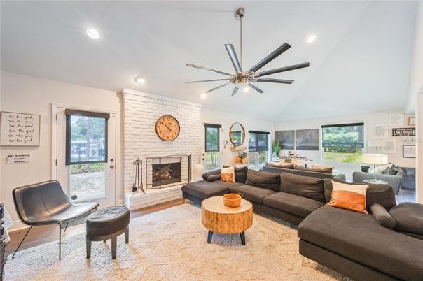 Fireplace, Interior, Living room, Recessed Lighting, Stone Walls, Wood Texture Flooring