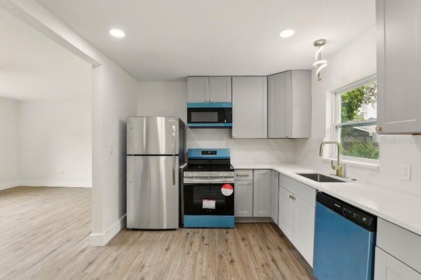 Interior, Kitchen, Pendant Lights, Recessed Lighting, Stainless Steel Appliances, Wood Texture Flooring