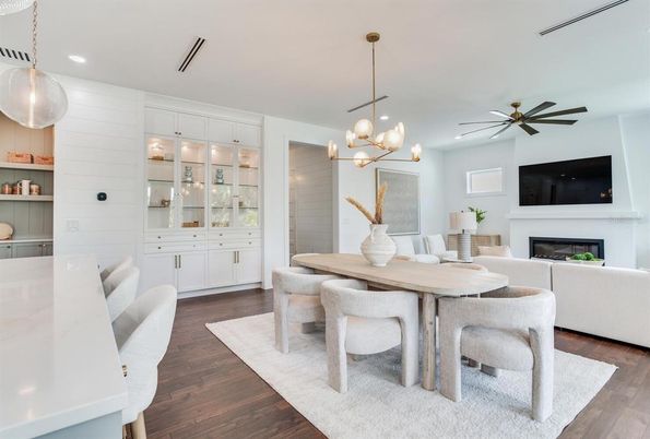 Dining room, Fireplace, Interior, Living room, Pendant Lights, Recessed Lighting, Wood Texture Flooring