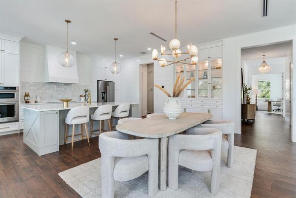 Dining room, Interior, Kitchen, Pendant Lights, Recessed Lighting, Stainless Steel Appliances, Wood Texture Flooring
