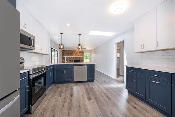 Interior, Kitchen, Pendant Lights, Recessed Lighting, Stainless Steel Appliances, Wood Texture Flooring