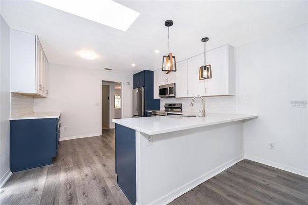 Interior, Kitchen, Pendant Lights, Recessed Lighting, Stainless Steel Appliances, Wood Texture Flooring