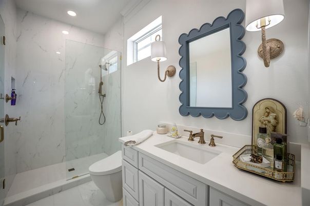 Bathroom, Dual Sink Vanities, Glass Shower, Interior, Marble, Marble Walls, Recessed Lighting