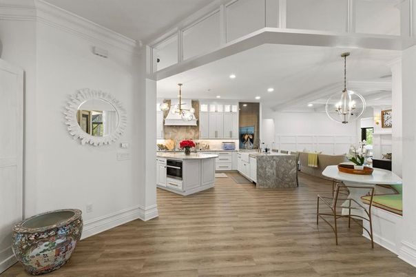 Chandelier, Dining room, Interior, Kitchen, Pendant Lights, Recessed Lighting, Stainless Steel Appliances, Wood Texture Flooring