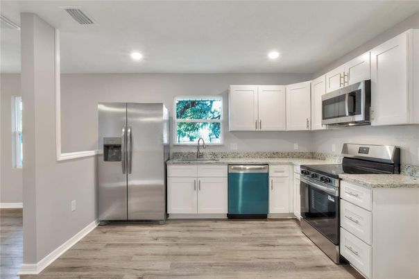 Interior, Kitchen, Recessed Lighting, Stainless Steel Appliances, Wood Texture Flooring