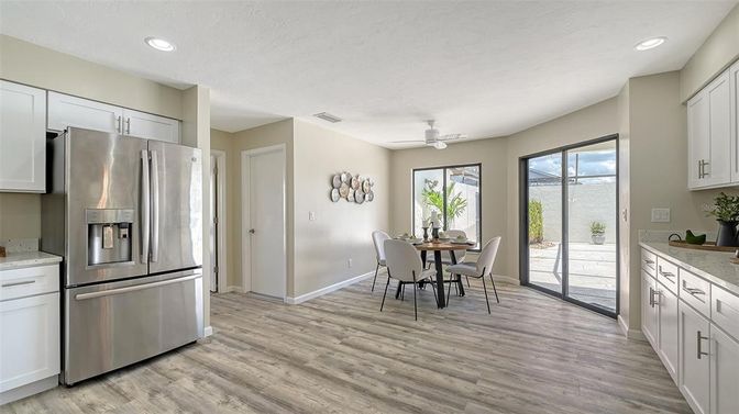 Dining room, Interior, Kitchen, Recessed Lighting, Stainless Steel Appliances, Wood Texture Flooring