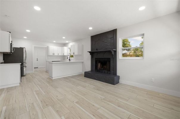 Fireplace, Interior, Kitchen, Recessed Lighting, Wood Texture Flooring