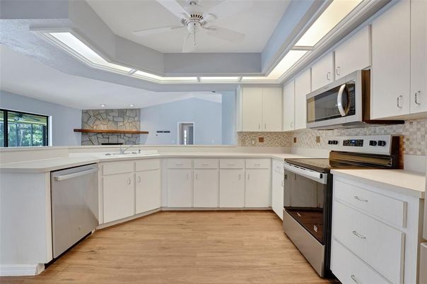 Interior, Kitchen, Recessed Lighting, Stainless Steel Appliances, Stone Walls, Wood Texture Flooring