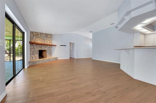 Empty room, Fireplace, Interior, Recessed Lighting, Wood Texture Flooring