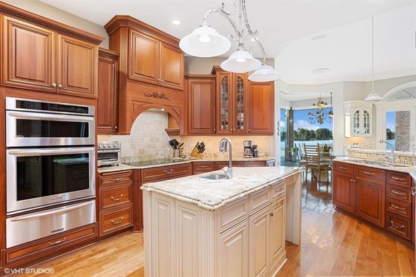 Chandelier, Dining room, Interior, Kitchen, Pendant Lights, Recessed Lighting, Stainless Steel Appliances, Wood Texture Flooring