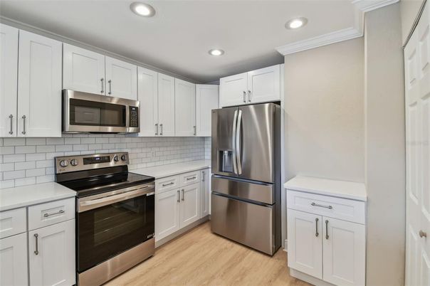 Interior, Kitchen, Recessed Lighting, Stainless Steel Appliances, Wood Texture Flooring