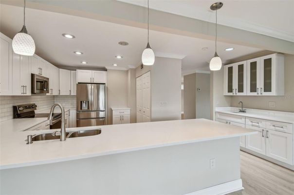 Interior, Kitchen, Pendant Lights, Recessed Lighting, Stainless Steel Appliances, Wood Texture Flooring