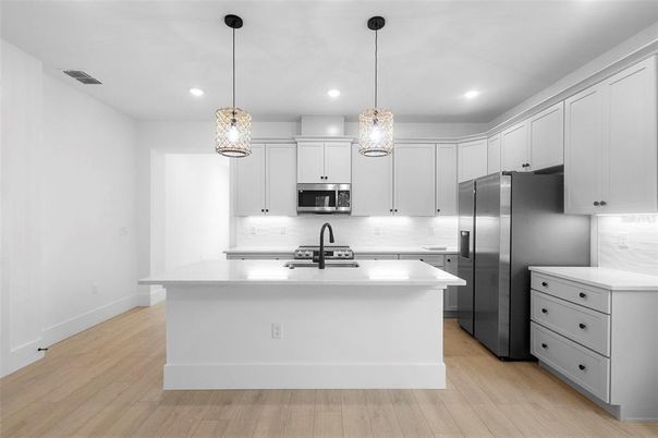 Interior, Kitchen, Pendant Lights, Recessed Lighting, Stainless Steel Appliances, Wood Texture Flooring