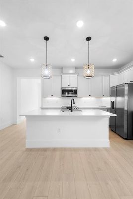 Interior, Kitchen, Pendant Lights, Recessed Lighting, Stainless Steel Appliances, Wood Texture Flooring