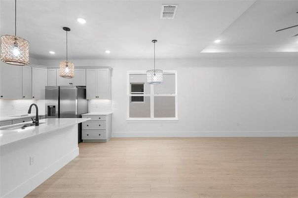 Interior, Kitchen, Pendant Lights, Recessed Lighting, Stainless Steel Appliances, Wood Texture Flooring