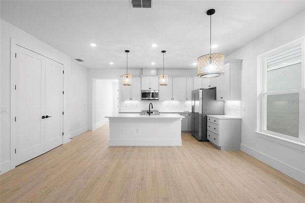 Interior, Kitchen, Pendant Lights, Recessed Lighting, Stainless Steel Appliances, Wood Texture Flooring