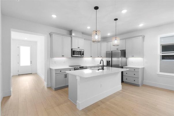 Interior, Kitchen, Pendant Lights, Recessed Lighting, Stainless Steel Appliances, Wood Texture Flooring