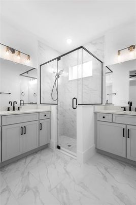 Bathroom, Dual Sink Vanities, Glass Shower, Interior, Marble, Marble Walls, Recessed Lighting
