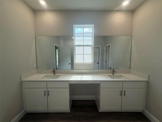 Bathroom, Dual Sink Vanities, Interior, Recessed Lighting, Wood Texture Flooring