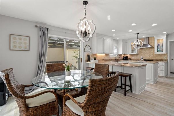 Chandelier, Dining room, Interior, Kitchen, Pendant Lights, Recessed Lighting, Stainless Steel Appliances, Wood Texture Flooring