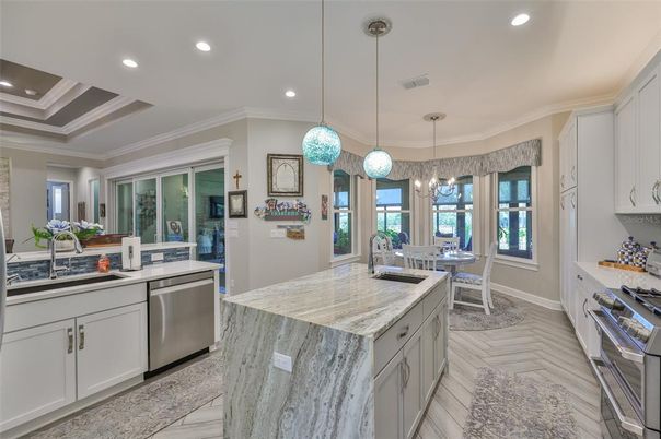 Dining room, Interior, Kitchen, Pendant Lights, Recessed Lighting, Stainless Steel Appliances, Wood Texture Flooring