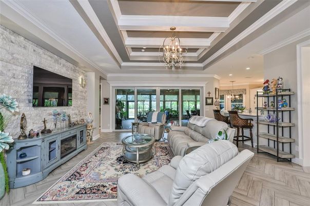 Chandelier, Interior, Living room, Pendant Lights, Recessed Lighting, Stone Walls, Wood Texture Flooring
