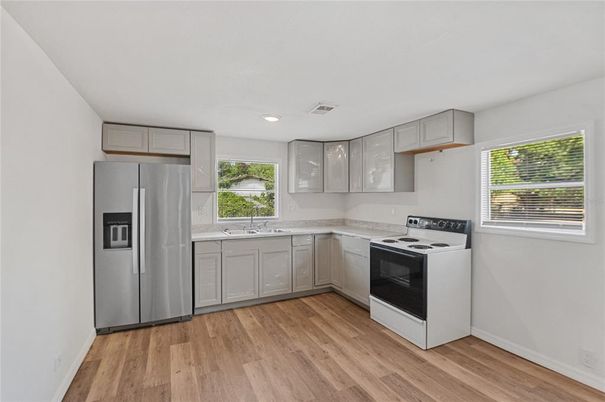 Interior, Kitchen, Recessed Lighting, Stainless Steel Appliances, Wood Texture Flooring