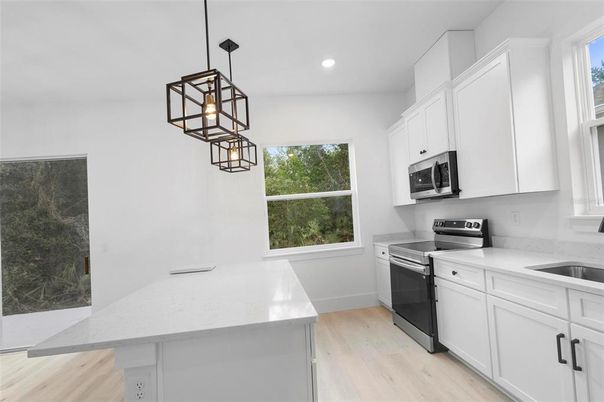 Interior, Kitchen, Pendant Lights, Recessed Lighting, Stainless Steel Appliances, Wood Texture Flooring