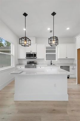 Interior, Kitchen, Pendant Lights, Recessed Lighting, Stainless Steel Appliances, Wood Texture Flooring