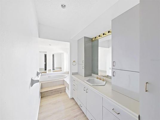 Bathroom, Dual Sink Vanities, Interior, Recessed Lighting, Wood Texture Flooring