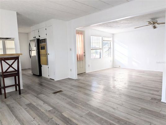 Empty room, Interior, Kitchen, Stainless Steel Appliances, Wood Texture Flooring