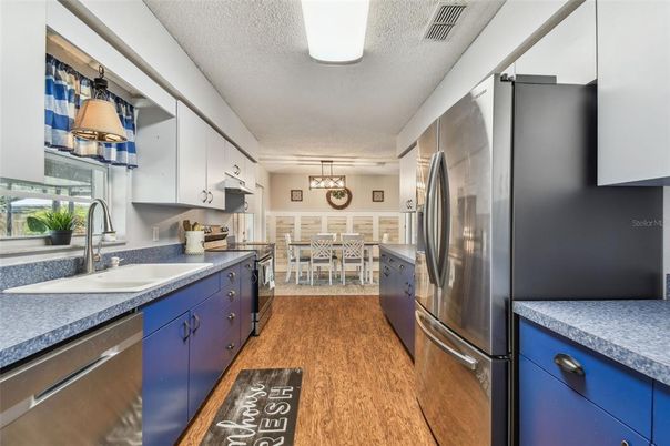 Dining room, Interior, Kitchen, Pendant Lights, Stainless Steel Appliances, Wood Texture Flooring