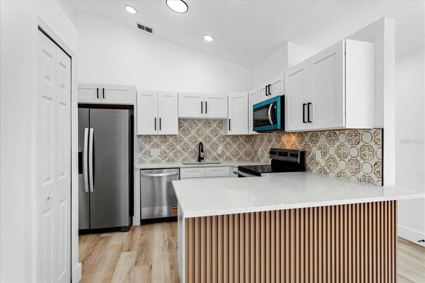Interior, Kitchen, Recessed Lighting, Stainless Steel Appliances, Wood Texture Flooring