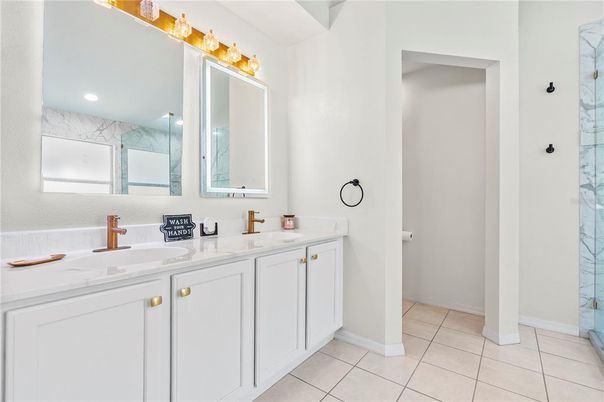 Bathroom, Dual Sink Vanities, Glass Shower, Interior, Marble Walls, Recessed Lighting