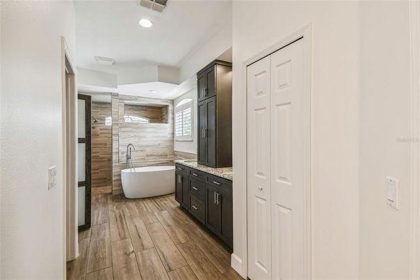 Bathroom, Dual Sink Vanities, Free Standing Baths, Interior, Recessed Lighting, Wood Texture Flooring