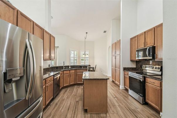 Dining room, Interior, Kitchen, Pendant Lights, Stainless Steel Appliances, Wood Texture Flooring