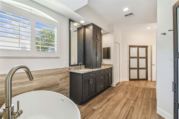 Bathroom, Dual Sink Vanities, Free Standing Baths, Interior, Recessed Lighting, Wood Texture Flooring