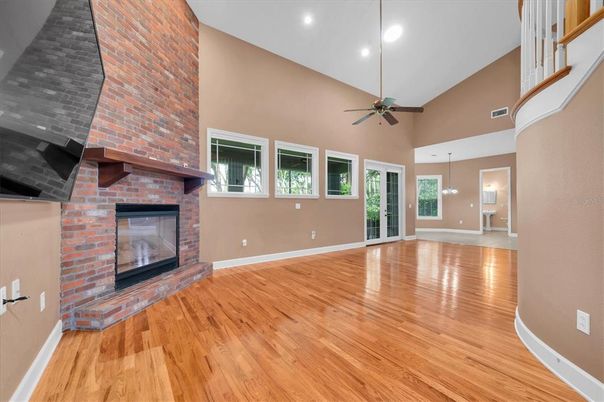 Empty room, Fireplace, Interior, Pendant Lights, Recessed Lighting, Stone Walls, Wood Texture Flooring