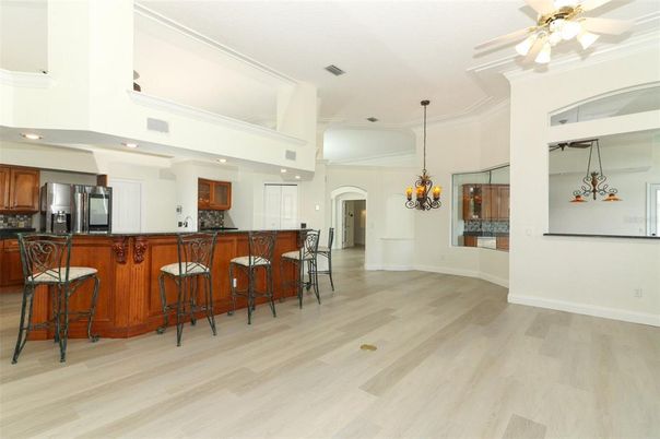 Chandelier, Interior, Kitchen, Pendant Lights, Recessed Lighting, Stainless Steel Appliances, Wood Texture Flooring