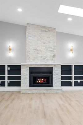 Fireplace, Interior, Recessed Lighting, Stone Walls, Wood Texture Flooring