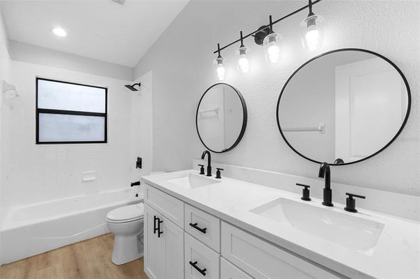 Bathroom, Dual Sink Vanities, Interior, Recessed Lighting, Wood Texture Flooring