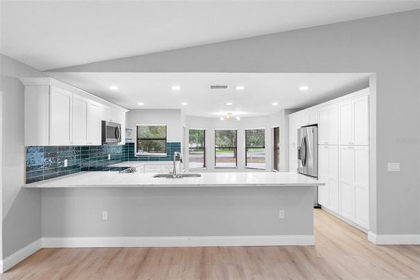 Interior, Kitchen, Recessed Lighting, Stainless Steel Appliances, Wood Texture Flooring